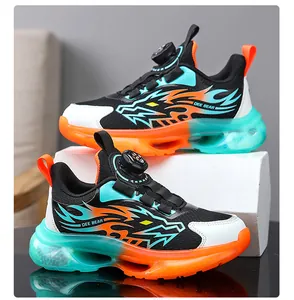 Detailed close-up view of boys' breathable mesh sports running shoes with dragon flame motif.