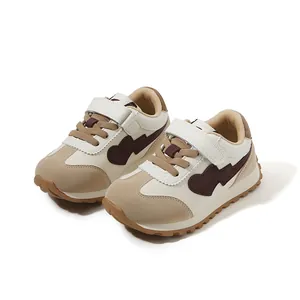 Vintage-style cream and beige toddler sneakers with velcro straps and heart patch