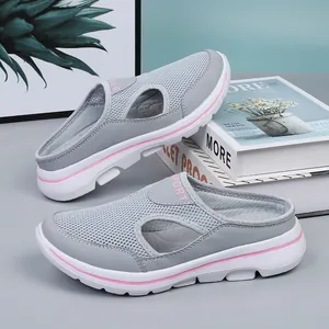 Comfortable grey breathable mesh slip-on mules with a pink sporty accent stripe