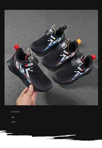 Close-up detail of boys' breathable mesh running sneakers with graffiti patterns