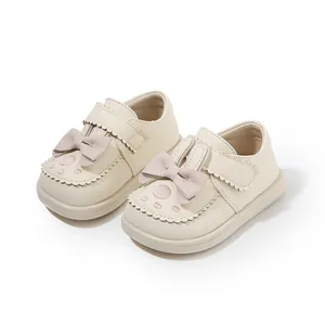 Cute cream colored toddler princess shoes with soft pink bows and rabbit ear details