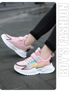 Close-up of pink children's sneakers with breathable mesh upper and velcro strap.
