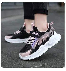 Detail view of breathable girls' mesh sneakers with pink and purple accents