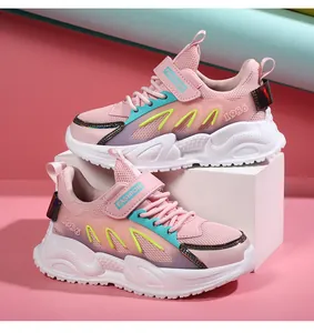 Detailed side view of pink girls' breathable mesh running shoes with Velcro straps.