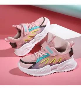 Detailed view of pink girls' mesh sneakers with 'FASHION' strap and chunky white sole