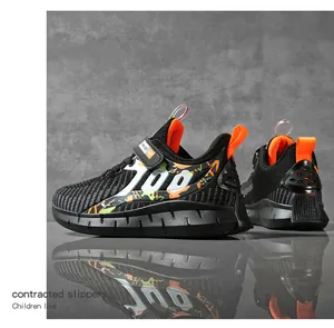 Detailed side view of breathable black and orange children's sports sneakers
