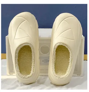 Detailed view of warm off-white fleece-lined clog slippers with soft cozy interior