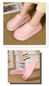 Detailed view of pink plush lined warm slippers with thick platform soles for indoor use
