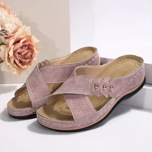 Comfortable pink suede wedge sandals for women featuring cross straps and golden studs