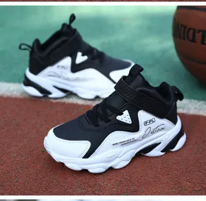 Baskets de basketball imperméables pour garçons en noir et blanc avec tige en cuir