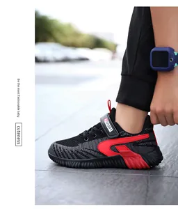 Detailed on-foot view of boys breathable flyknit sports running shoes in black and red
