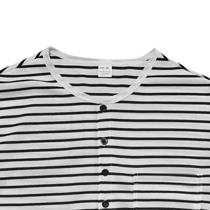 Macro detail shot showing the striped Henley shirt neckline and pique fabric texture.