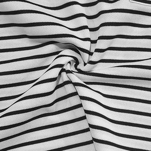 Detailed macro view of black and white striped pique fabric texture for men's shirt