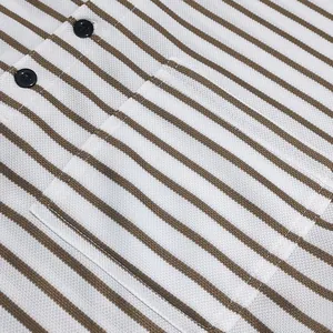 Close-up detail of a men's striped piqué henley t-shirt showing pocket and buttons