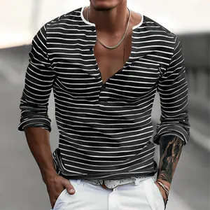 Close-up detail of a men's slim fit long-sleeve striped Henley shirt in piqué fabric.
