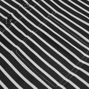 Close-up detail of black and white striped piqué fabric on a men's Henley shirt