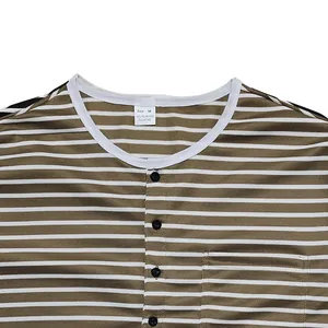 Detailed view of striped men's long-sleeve Henley shirt collar with buttons and pocket