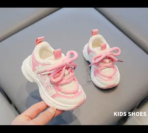 Close-up of pink and white baby chunky sneakers with mesh upper and soft non-slip sole