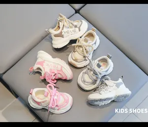 Assorted colors of kids chunky sneakers for 2-4 year olds displayed on a grey surface