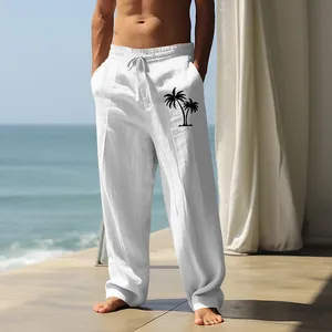 Men's loose white cotton linen casual pants featuring a black palm tree graphic print