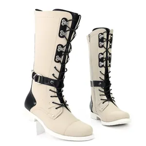 Detailed side view of vintage men's cream knight motorcycle boots with black lace-up design