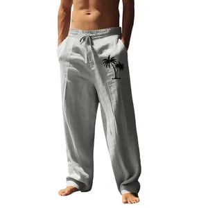 Detail of men's loose cotton linen casual pants featuring a black palm tree print