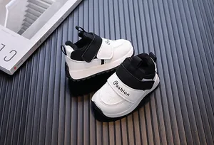 Detail view of stylish black and white waterproof leather sneakers for toddlers