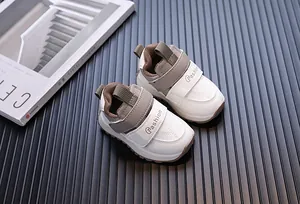 Close-up of baby sneakers featuring waterproof leather and secure velcro straps