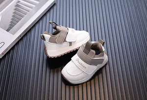 Close-up of the waterproof leather surface and Velcro strap on these infant sneakers