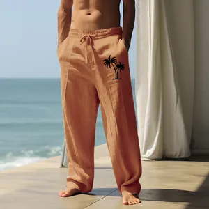 Close-up view of men's loose breathable cotton linen pants with palm tree print