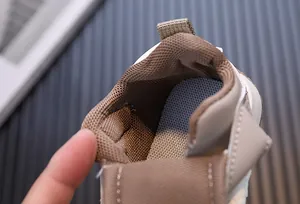 Close-up detail showing the breathable mesh lining and soft insole of kids' shoes