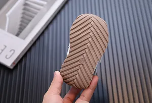 Detailed macro shot showing the anti-slip herringbone tread on toddler walking shoes