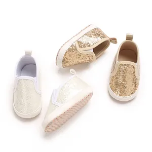 Detail view of sparkly gold and silver PU soft sole baby shoes for infants and toddlers