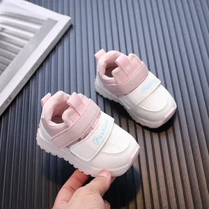 Charming pink and white toddler baby walking shoes with waterproof leather finish
