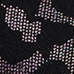 Macro detail of black leopard print fabric texture for summer beach wedge sandals