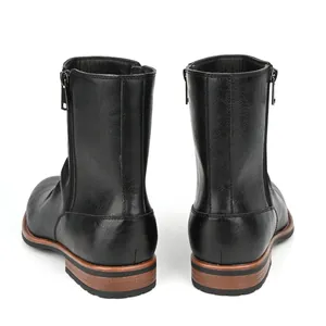 Rear view of black men's ankle boots with side zippers and pleated round toe design.