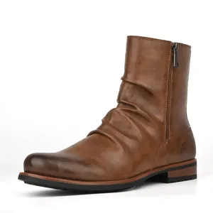 Side view detail of a brown ruched leather men's boot with a functional side zipper.