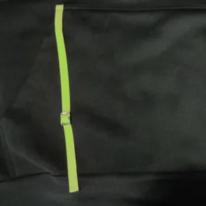 Close-up detail of the neon green strap and silver buckle on a black men's fleece hoodie.