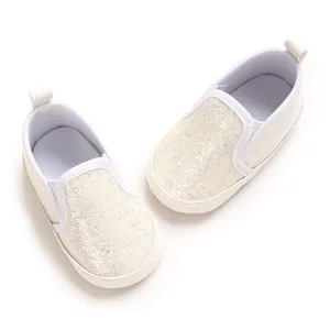 Close-up detail of white glitter PU soft-sole casual walking shoes for newborn infants
