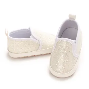 Detail view of sparkly silver glitter soft sole infant pre-walker shoes for baby girls
