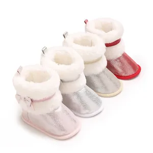 Rows of glittery baby winter boots with white faux fur trim in multiple colors