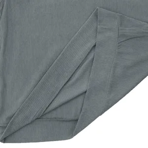 Macro detail view of grey corduroy sweatshirt showing high-quality ribbed fabric texture