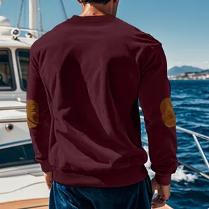 Detailed back view of men's burgundy corduroy sweatshirt featuring brown elbow patches