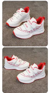 Dettaglio scarpe sportive bianche da bambina con ricami floreali e accenti rossi.