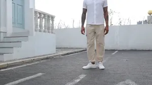 Full view of men's beige cotton linen cargo pants with drawstring and multi-pockets