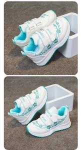 Dettaglio scarpe sportive bianche per bambine con ricami floreali turchesi e chiusura velcro