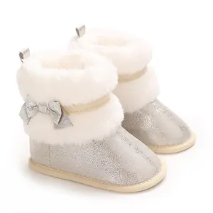 Detailed view of silver glitter infant walking shoes with white faux fur collar and bow
