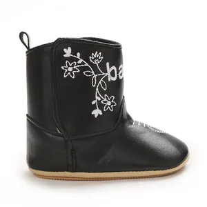 Detailed close-up view of a black baby winter cotton boot with white floral embroidery