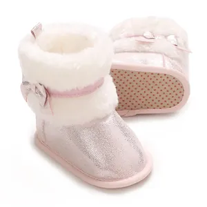Pink sparkly baby girls' winter boots with white faux fur collar and cute bow detail.
