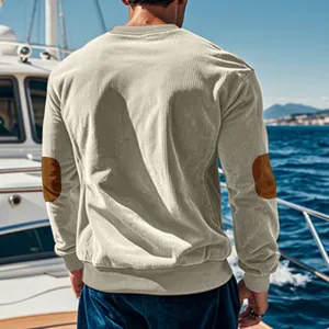 Rear view of men's corduroy sweatshirt featuring brown contrast elbow patches on a yacht.
